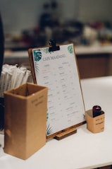 brown cardboard box with white printer paper
