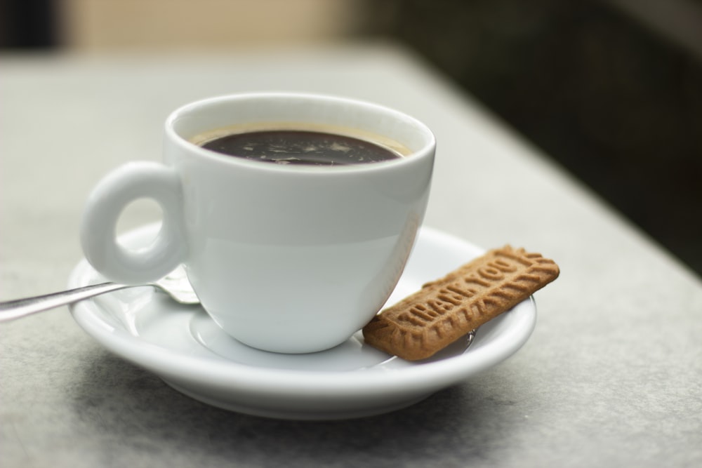 white ceramic cup with coffee