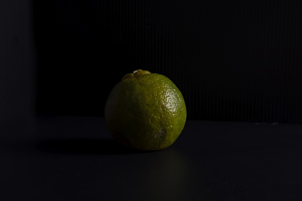 yellow lemon fruit on black surface