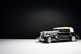 Minimalist silhouette of a classic car in elegant black and white tones.