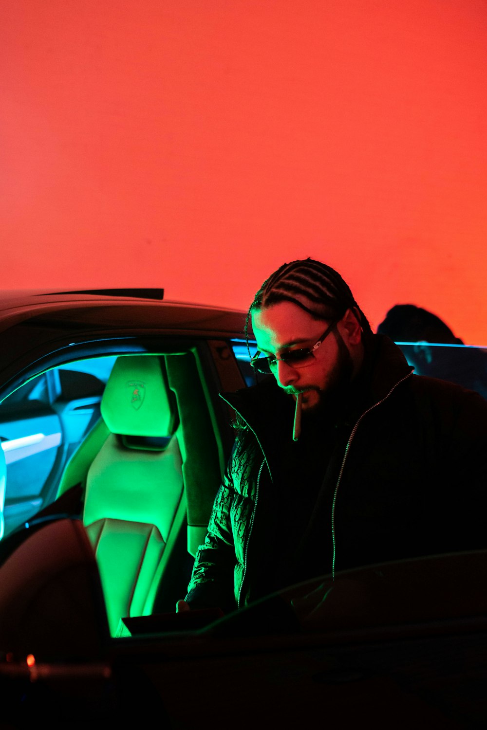 man in black jacket sitting inside car