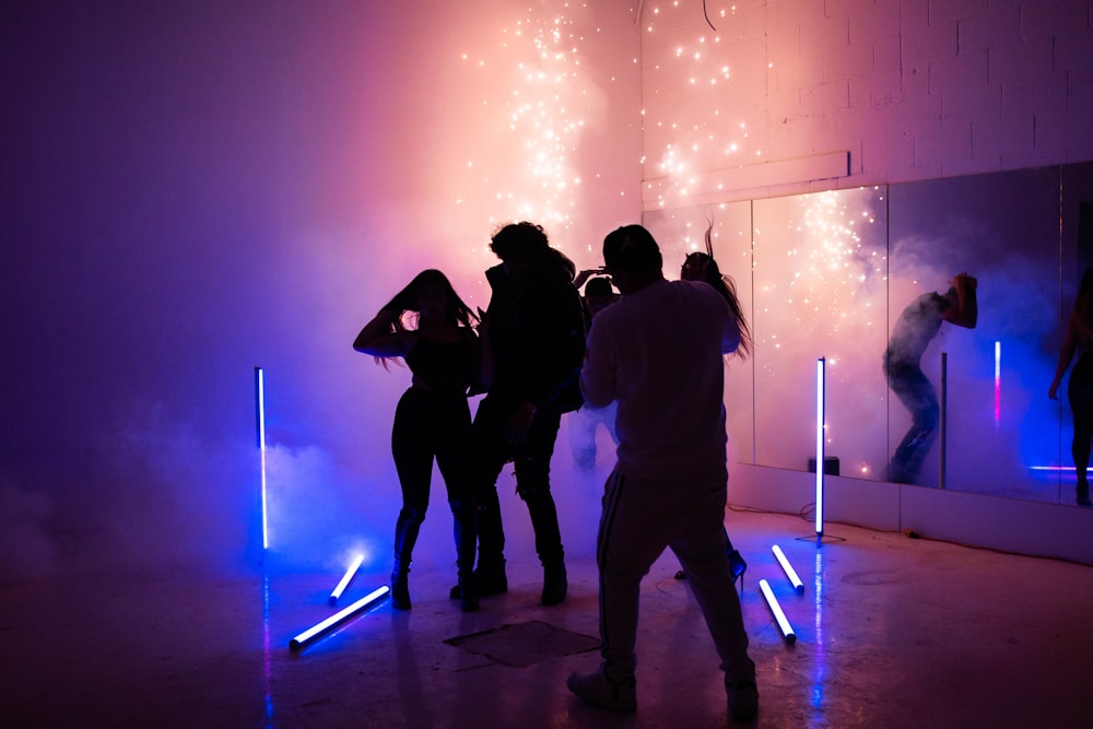 silhouette of people standing on stage