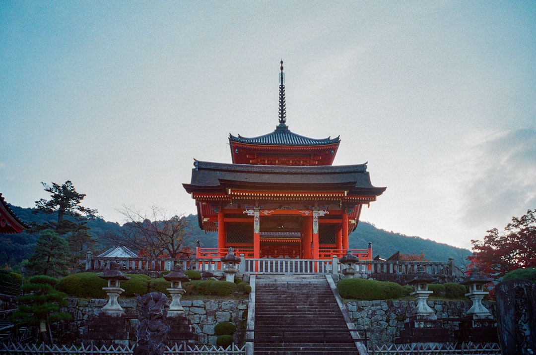 red and white temple under white sky during daytime