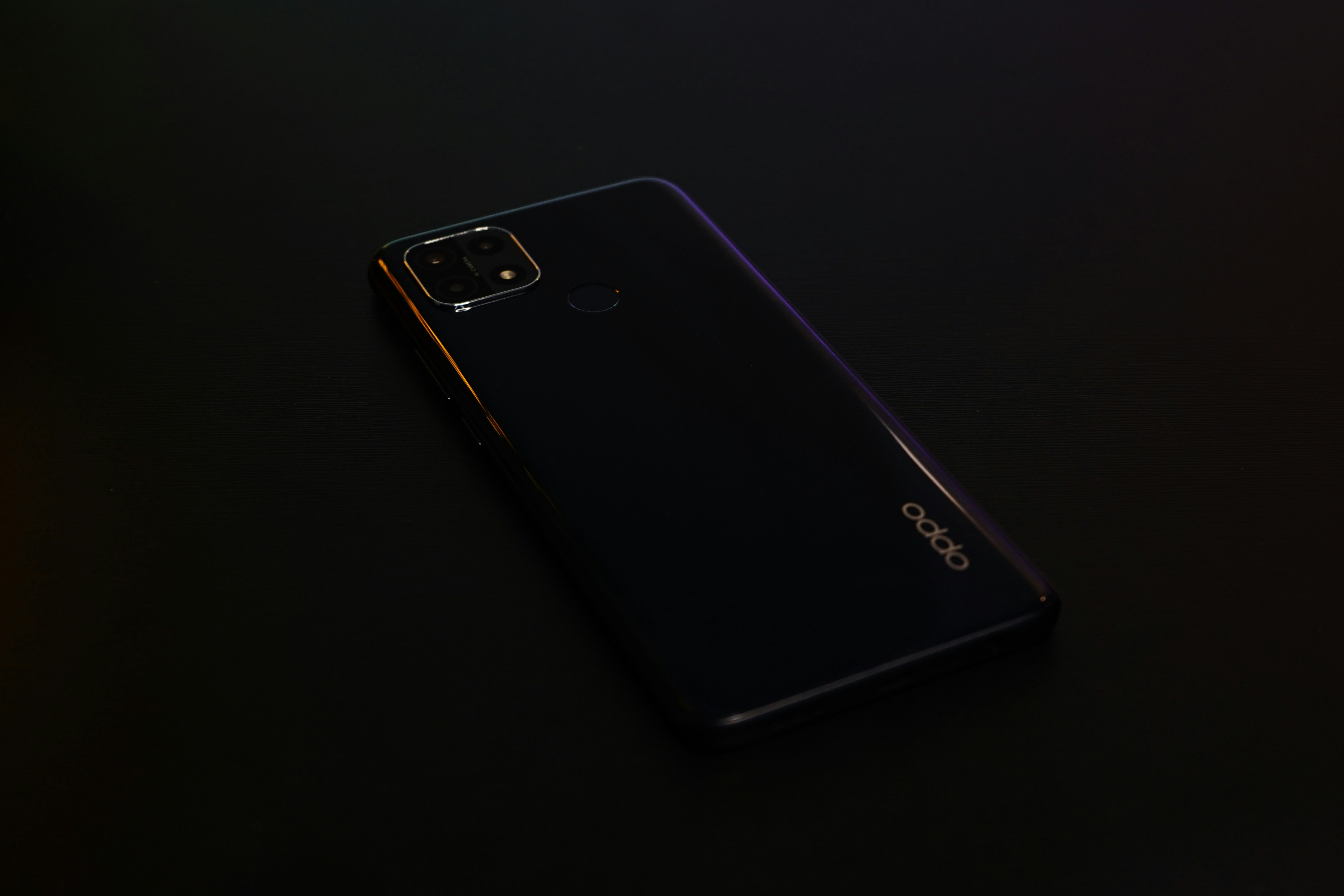 black samsung android smartphone on black surface