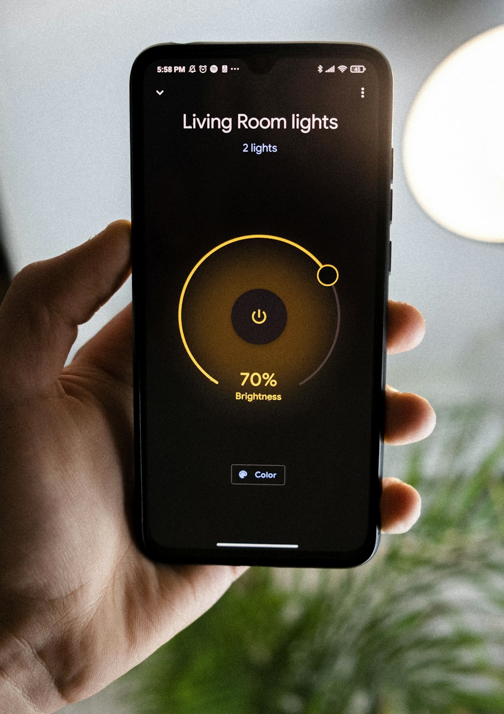 smart home features - Phone controls Living Room Lights | Photo by Moritz Kindler from Unsplash
