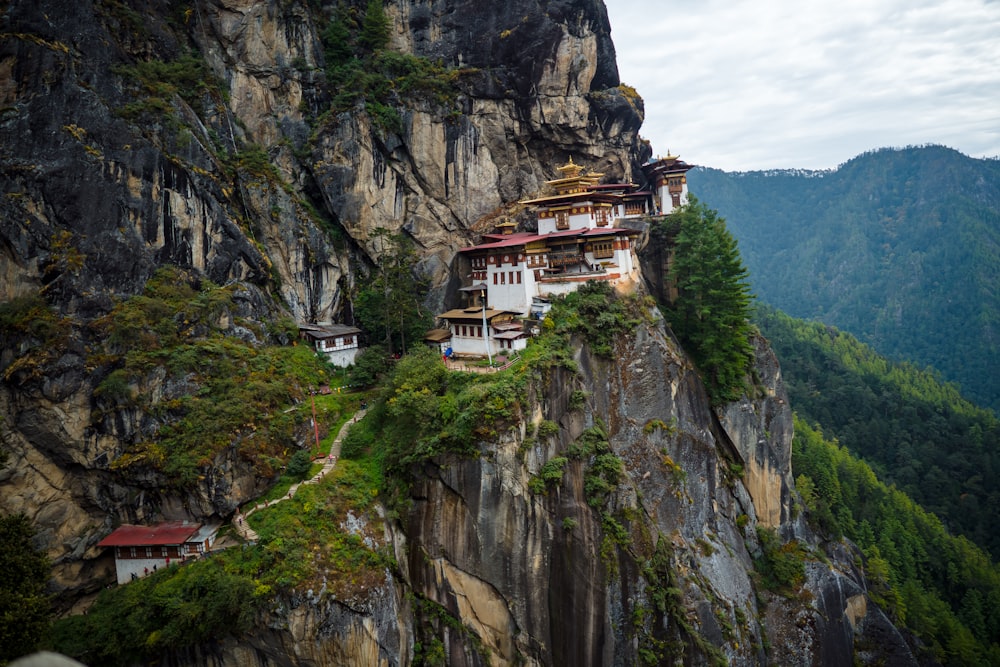 white and brown concrete house on top of mountain during daytime