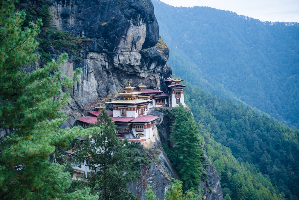 white and brown concrete building on top of mountain during daytime