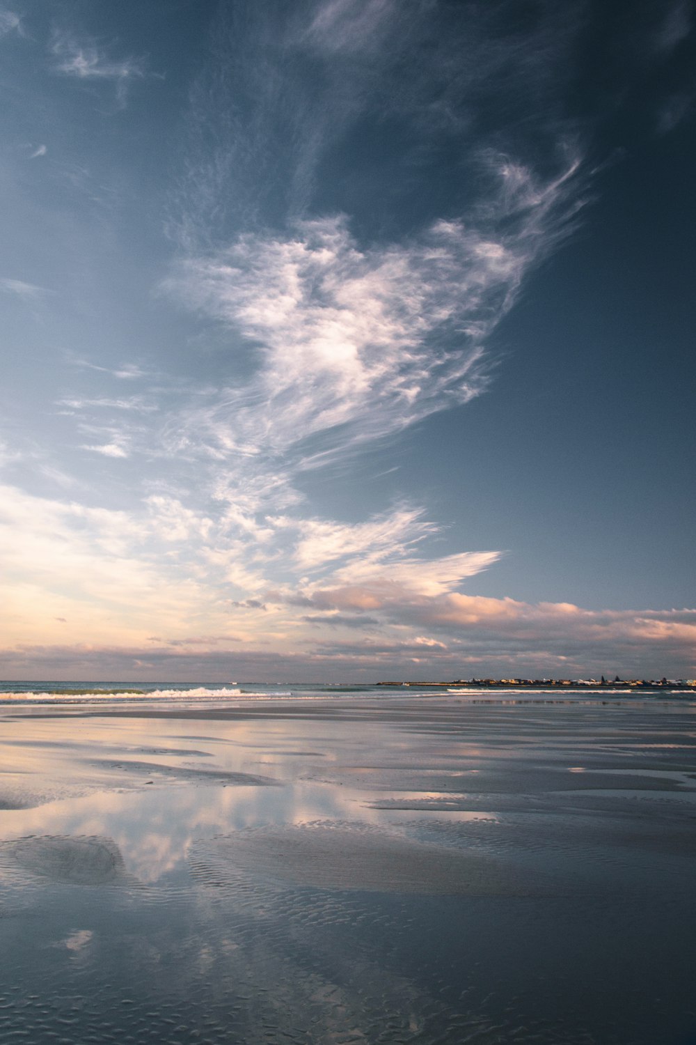 body of water under blue sky during daytime