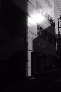Freshly painted building facade reflecting sunlight in an urban area.