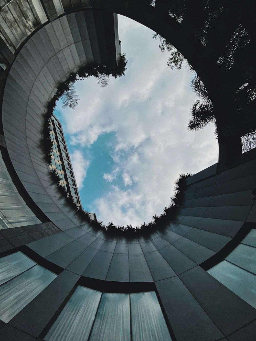 worms eye view of blue sky and white clouds during daytime