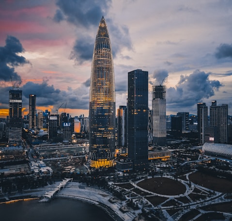 city buildings under cloudy sky during daytime