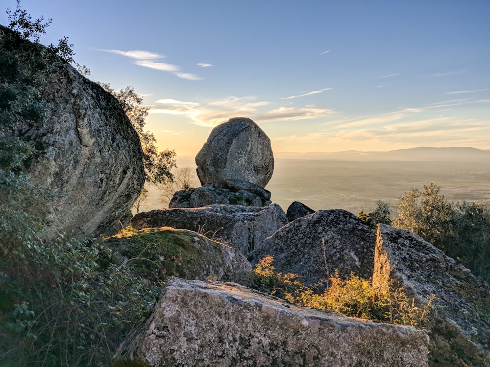 gray rock formation on brown grass field during daytime