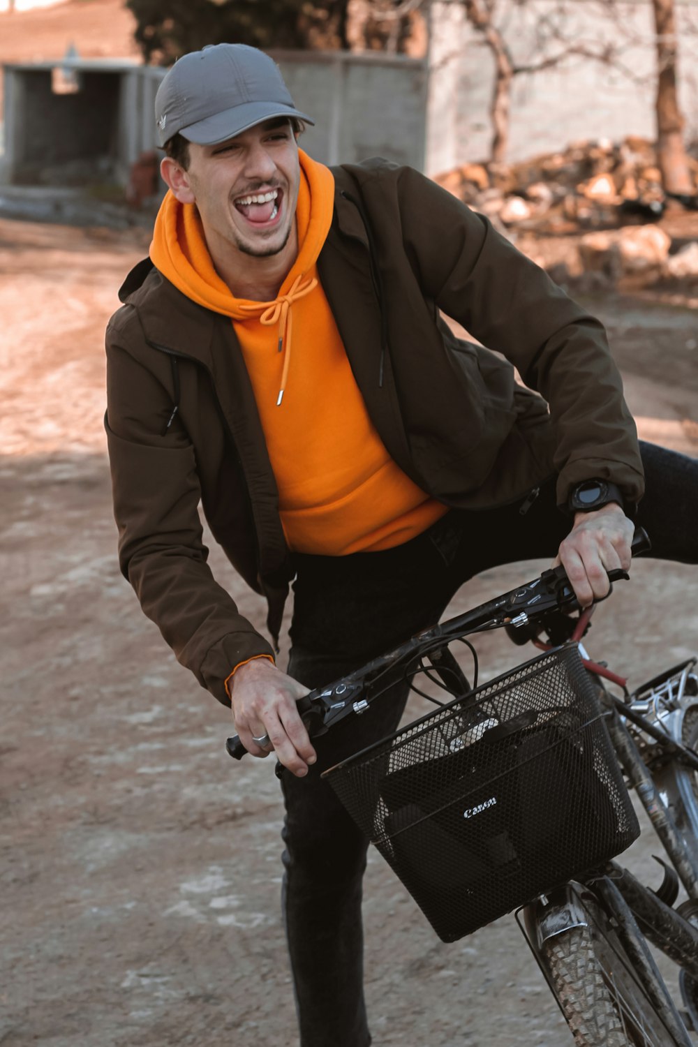 woman in black jacket riding on black bicycle