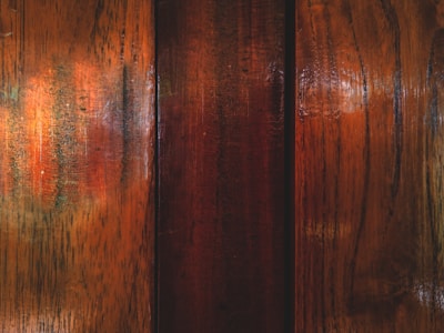 A close-up of a beautifully refinished hardwood floor with a glossy finish.