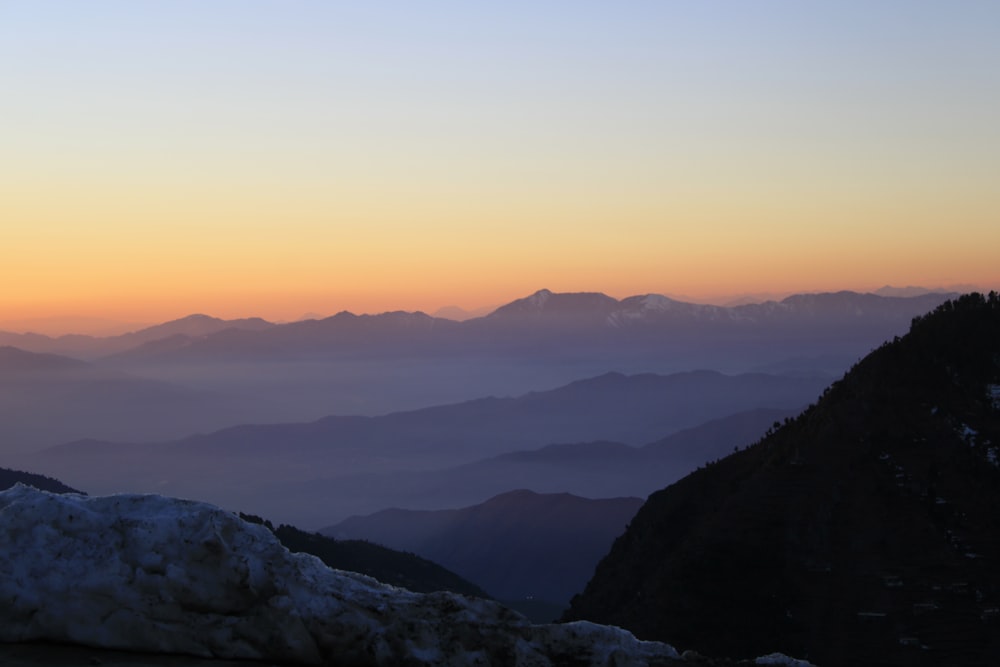 silhouette of mountains during sunset