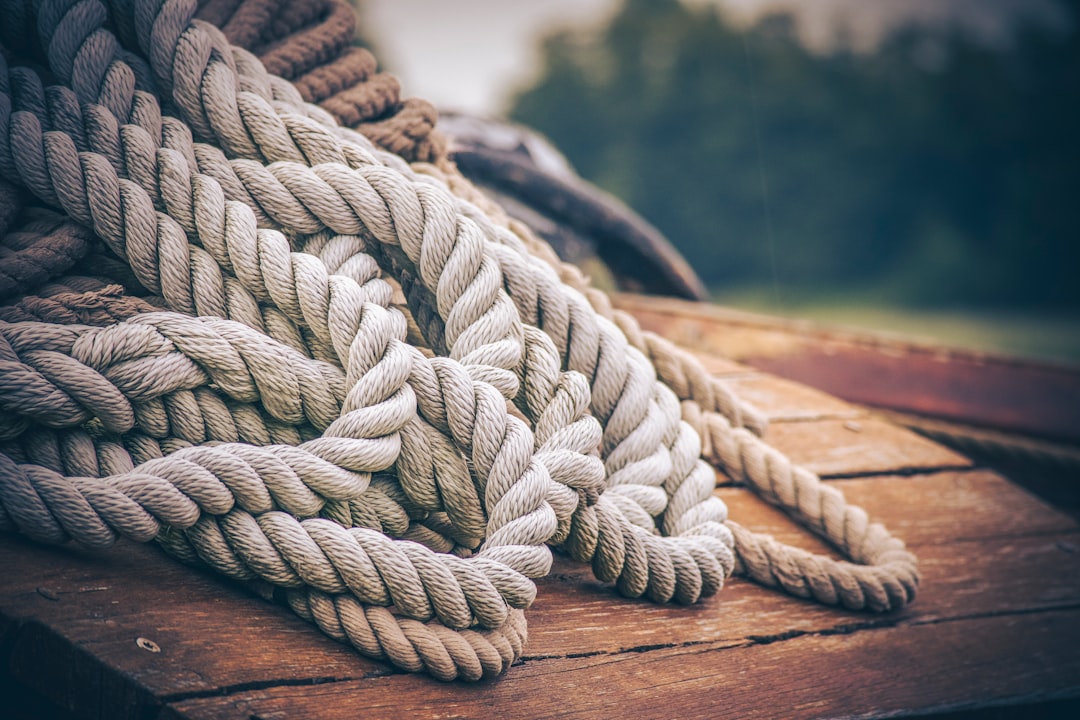 gray rope on brown wooden table