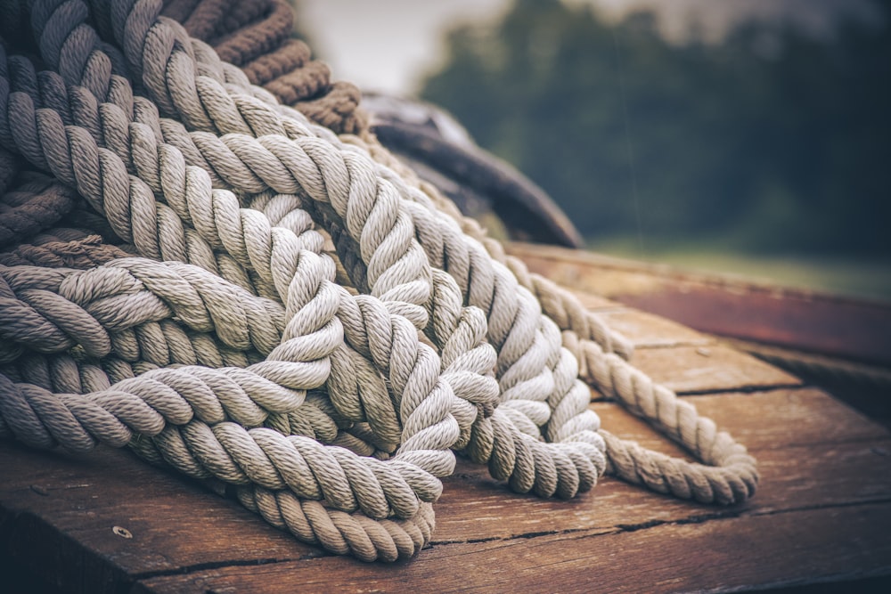 gray rope on brown wooden table
