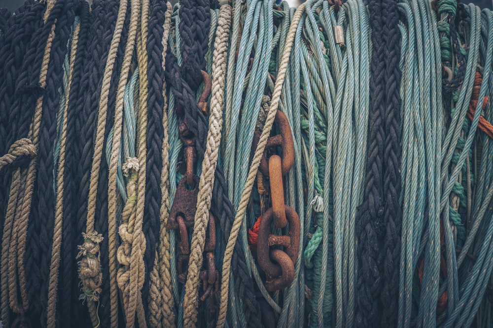 blue and white rope on brown metal bar