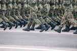 men in green and brown camouflage uniform