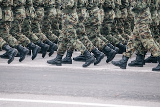 men in green and brown camouflage uniform