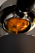 clear drinking glass with brown liquid