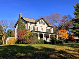 Cozy two-bedroom home with a white picket fence and a blooming garden in Shelburne.