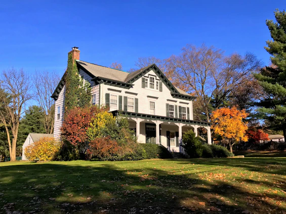 Cozy two-bedroom home with a white picket fence and a blooming garden in Shelburne.