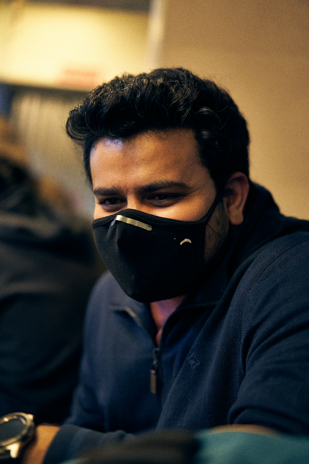 man in black hoodie wearing black mask