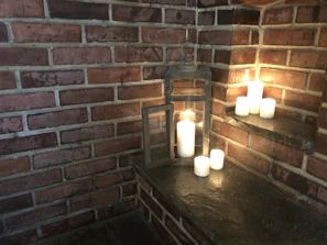 A serene corner with soft lighting featuring llumaterra's signature candle designs.
