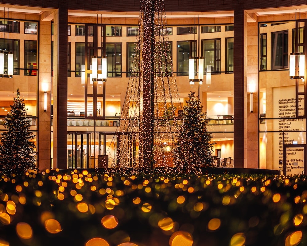 yellow round lanterns in front of brown building during night time