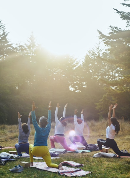 group of people raising their hands