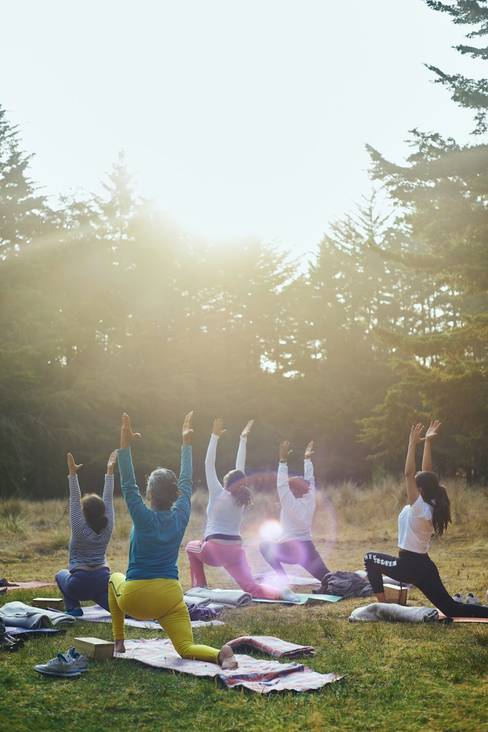 group of people raising their hands