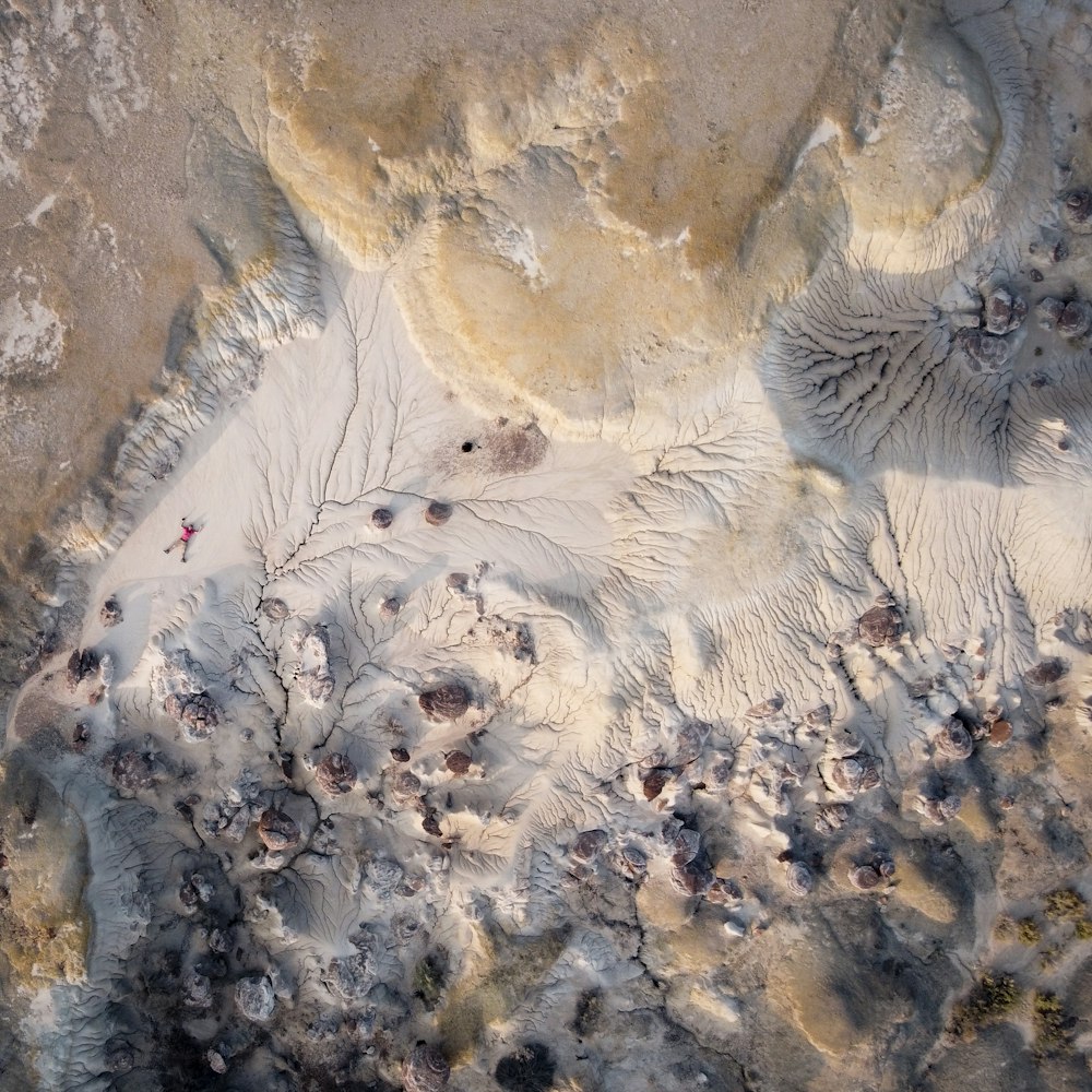 birds eye view of white and brown sand