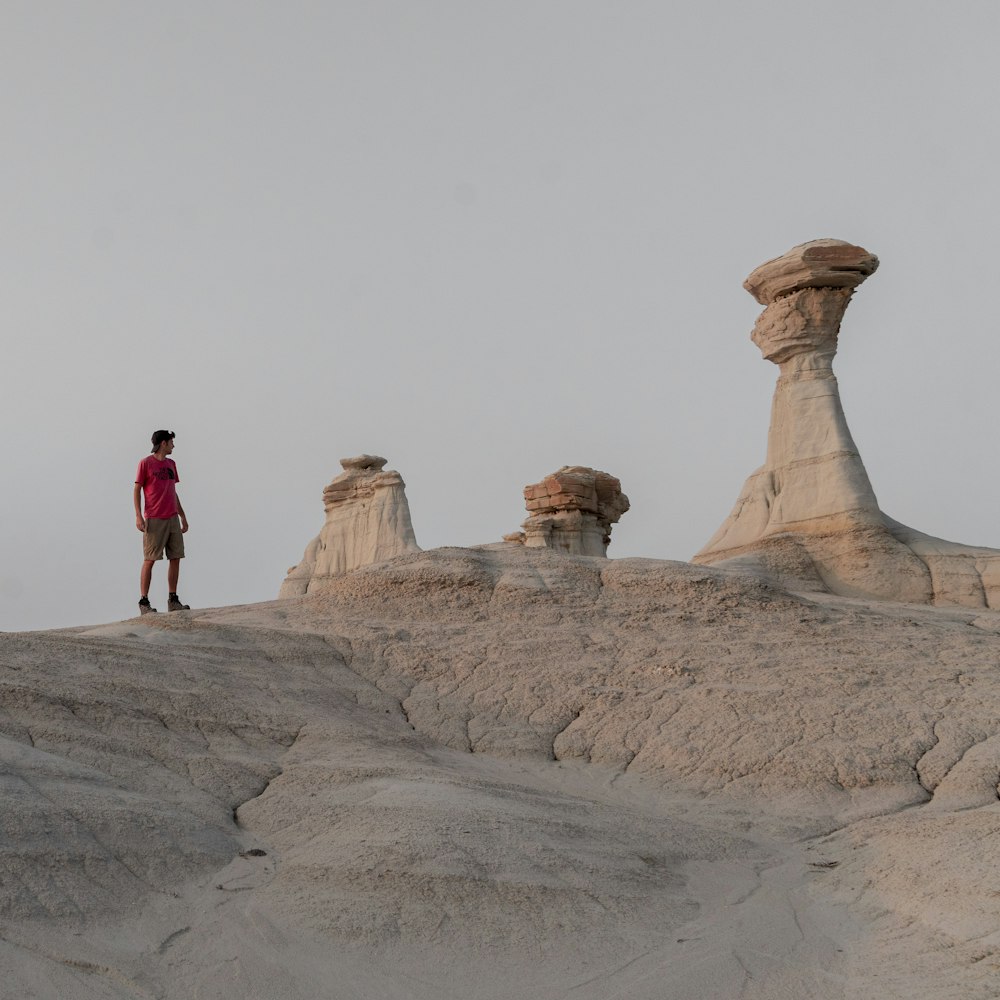 people walking on rocky hill during daytime