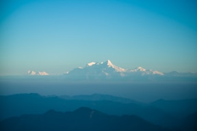 snow covered mountain under blue sky during daytime
