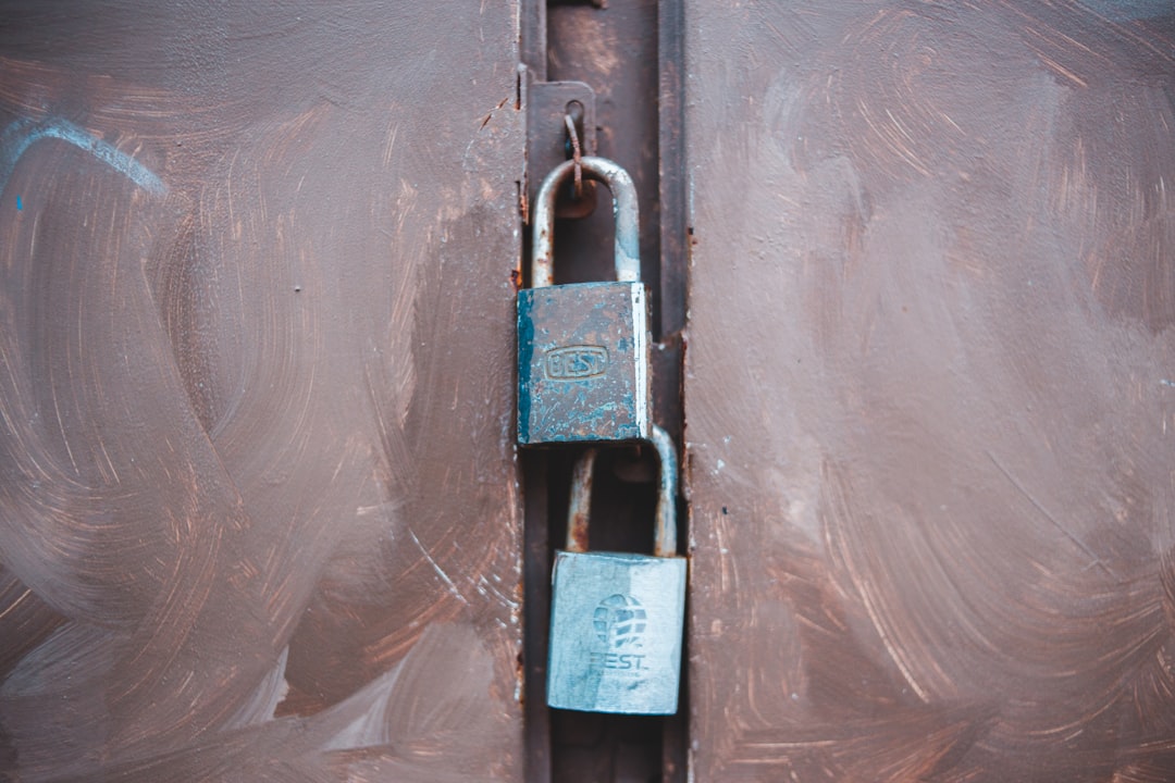 black and silver padlock on white plastic