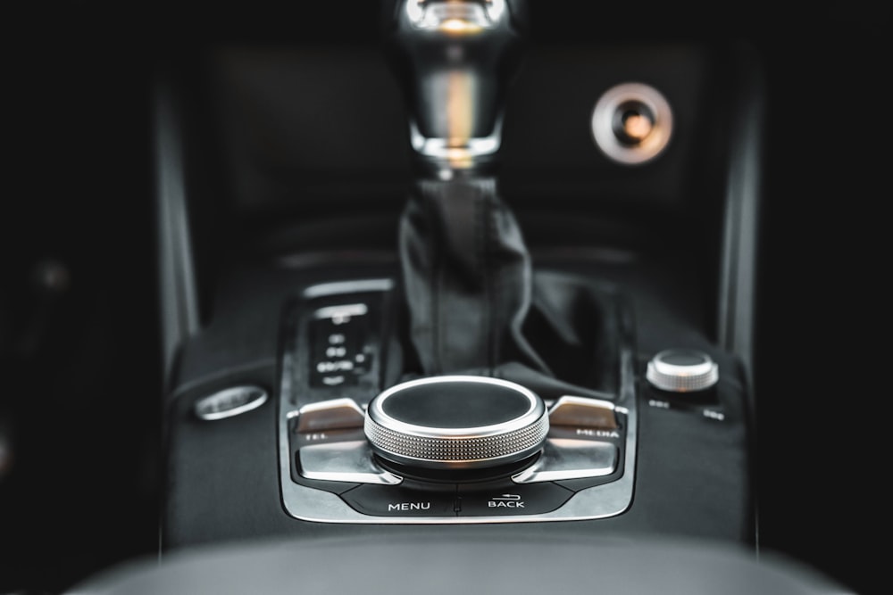 a close up of a steering wheel with a button