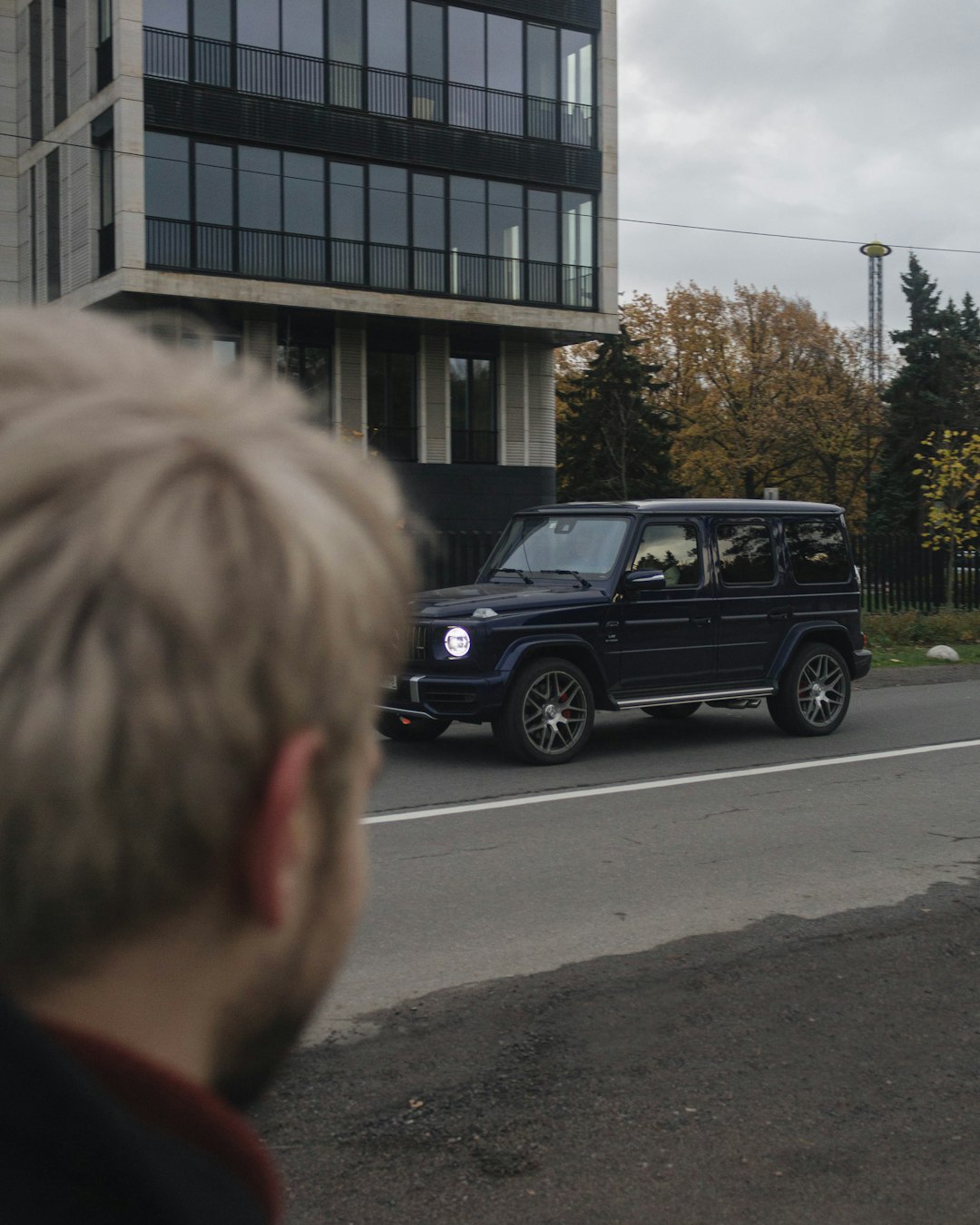 black suv parked near building during daytime