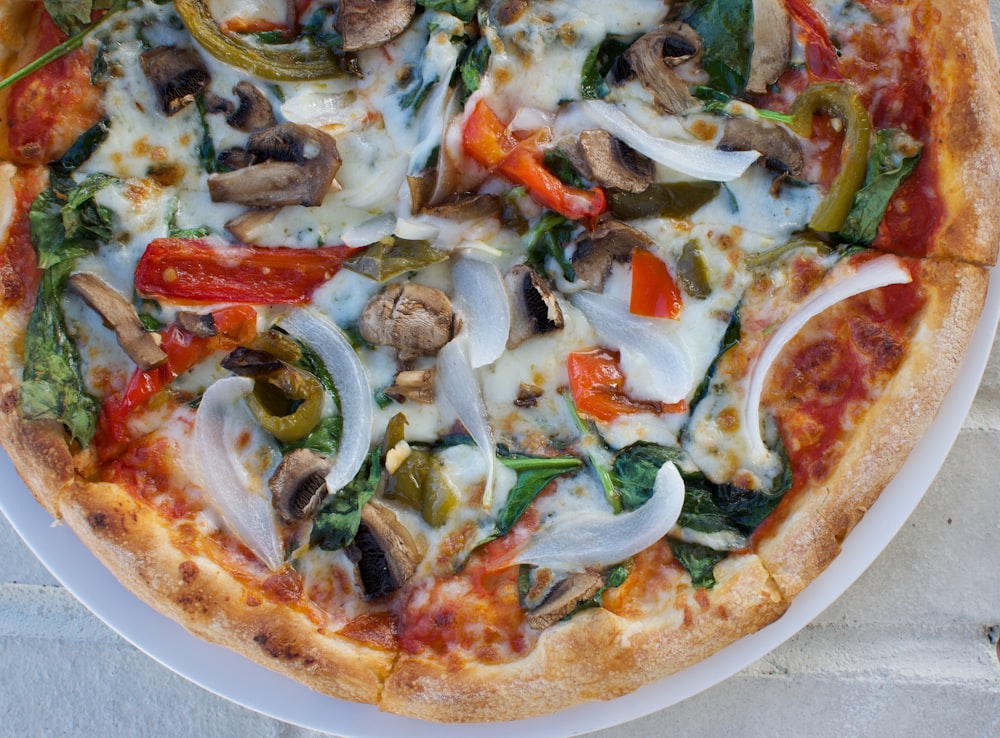 pizza with green and red vegetables