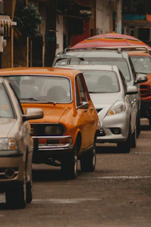 white and orange car on road during daytime