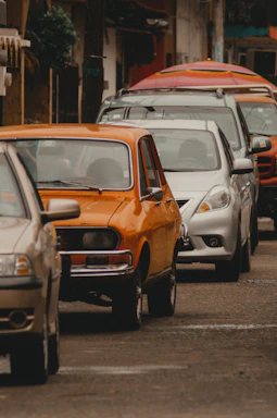 white and orange car on road during daytime