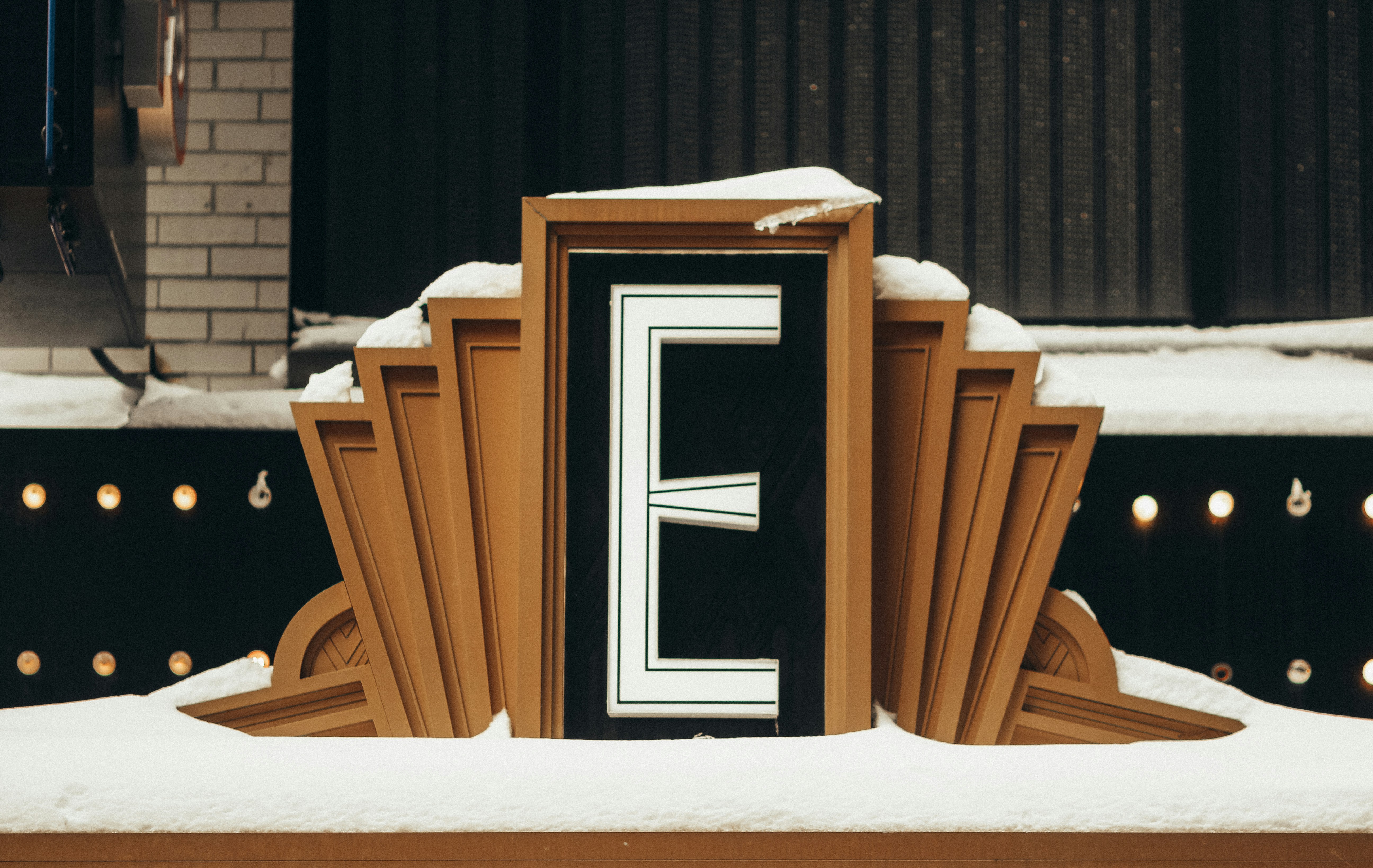 brown wooden chair on snow covered ground