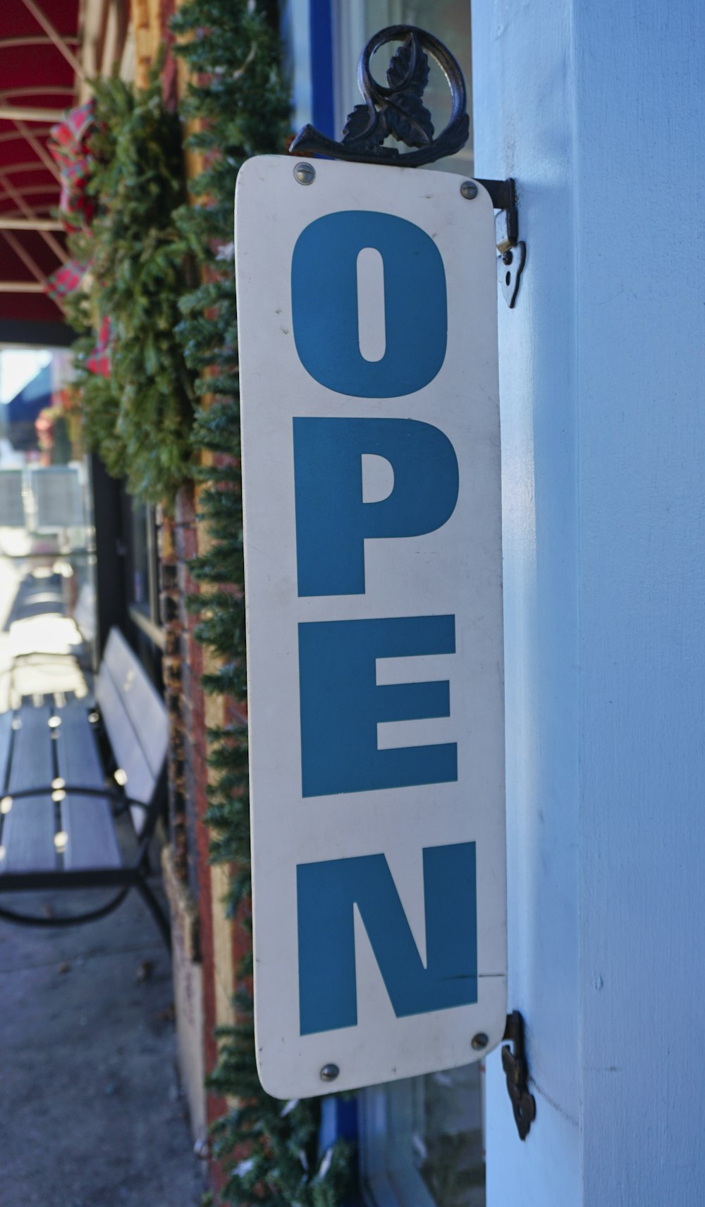 blue and white wooden signage