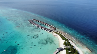 aerial view of white sand beach during daytime