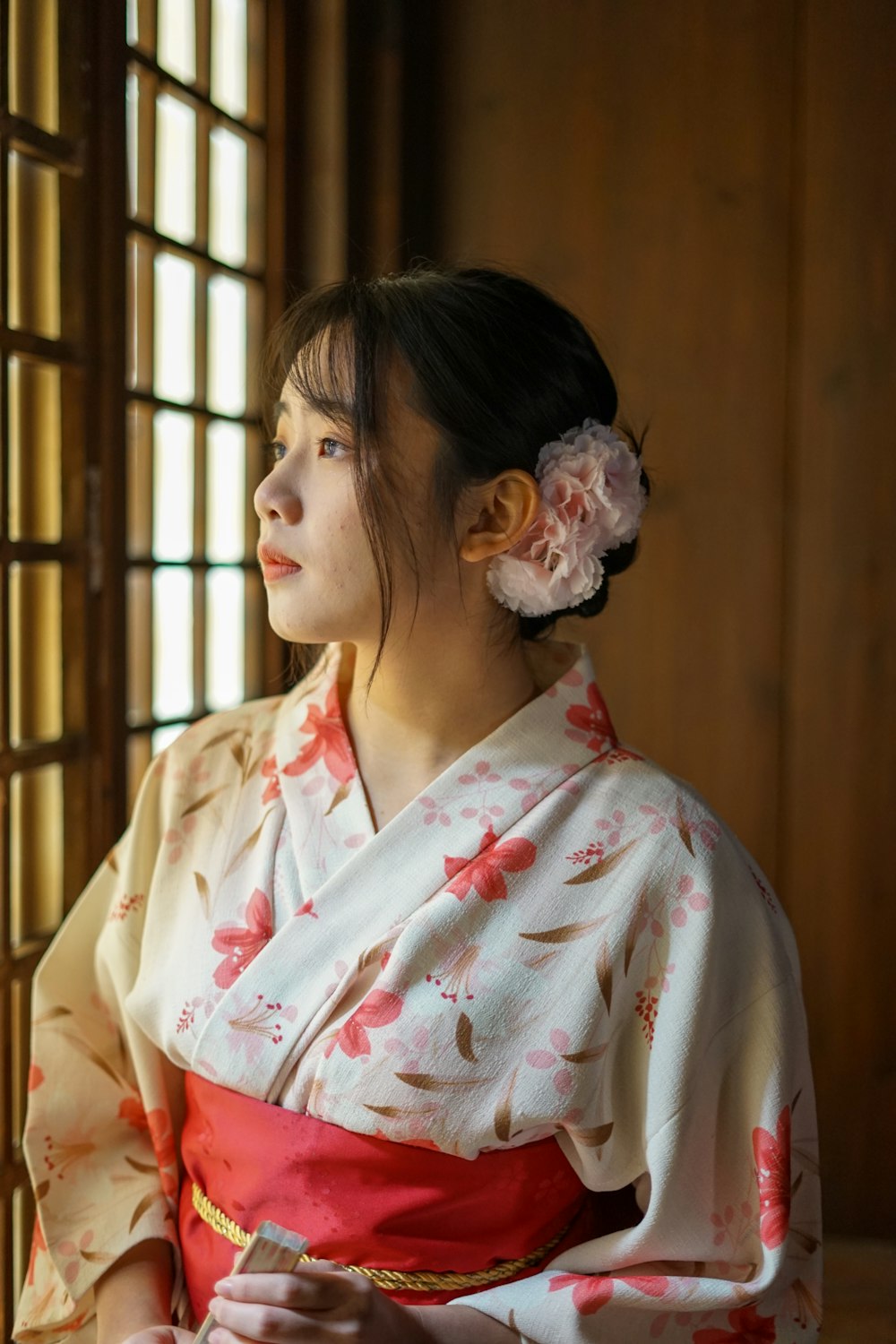 woman in white and red floral robe