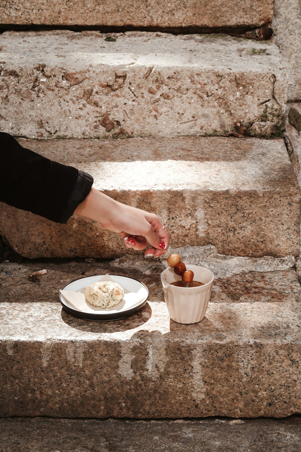 person holding white ceramic bowl with food