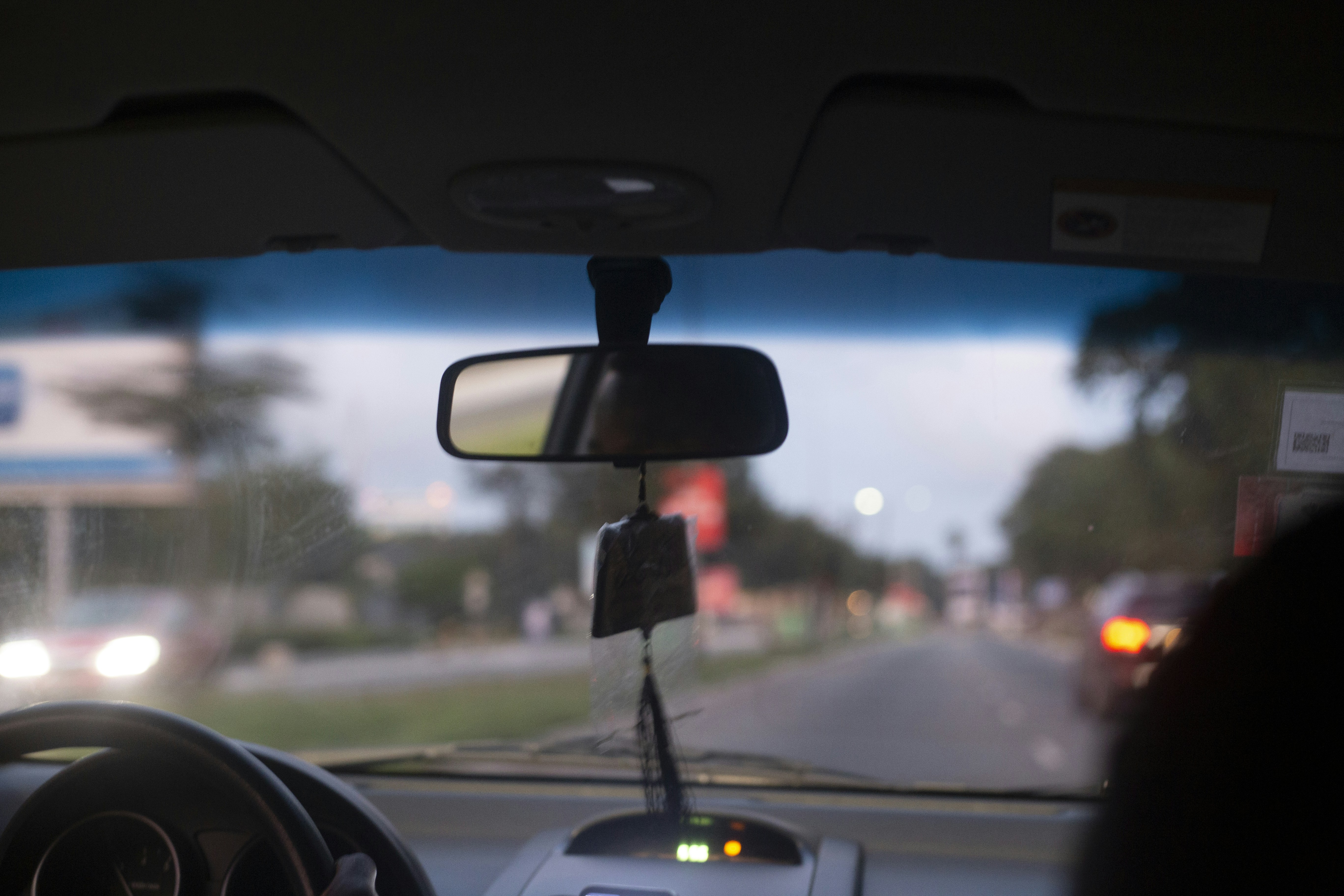 Self-driving car on highway with sensor visualization overlay showing detected objects