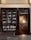 A storefront with glass windows displaying books on shelves. The book covers are of various colors and designs. There is a glass door on the right side, illuminated by warm light from inside, revealing a staircase.