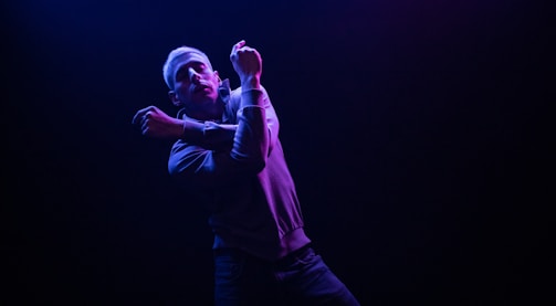 3D animated character model in a dynamic pose with vibrant lighting.