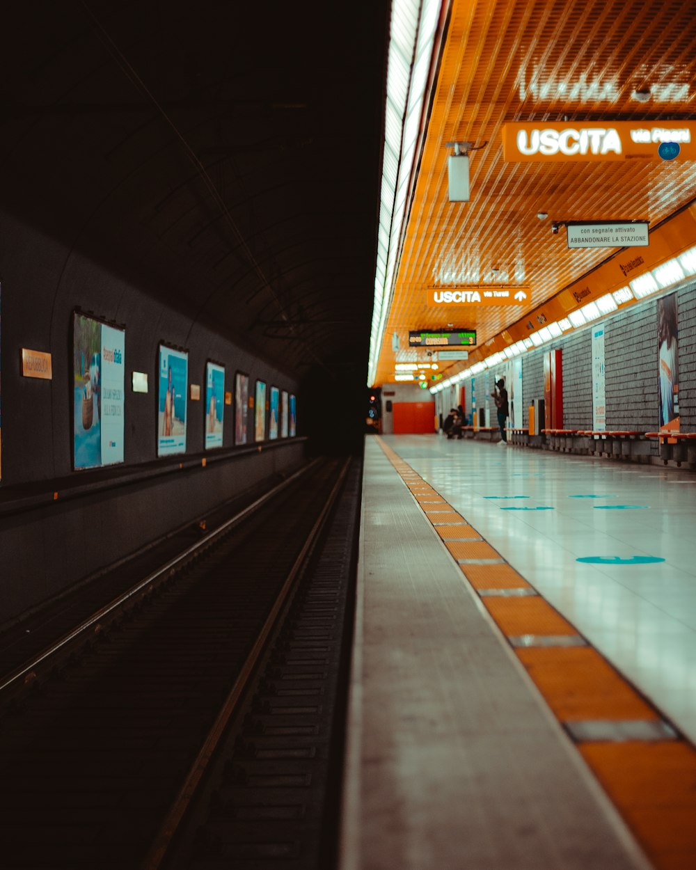 train station with lights turned on during night time